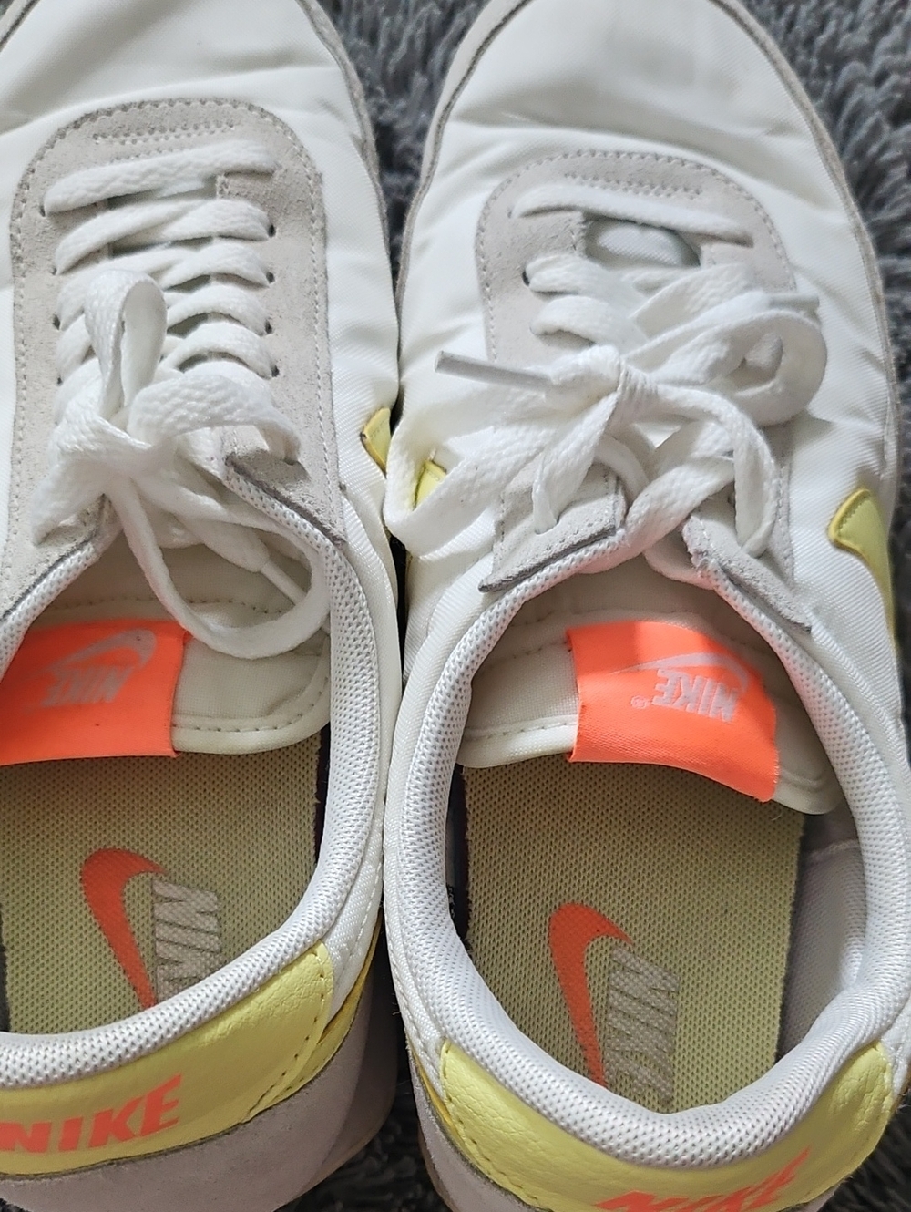 Nike White Sneakers with Yellow Heel and Neon Orange Accents